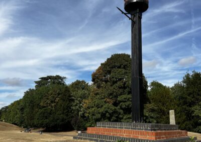 An image of the beacon with a blue sky behind it